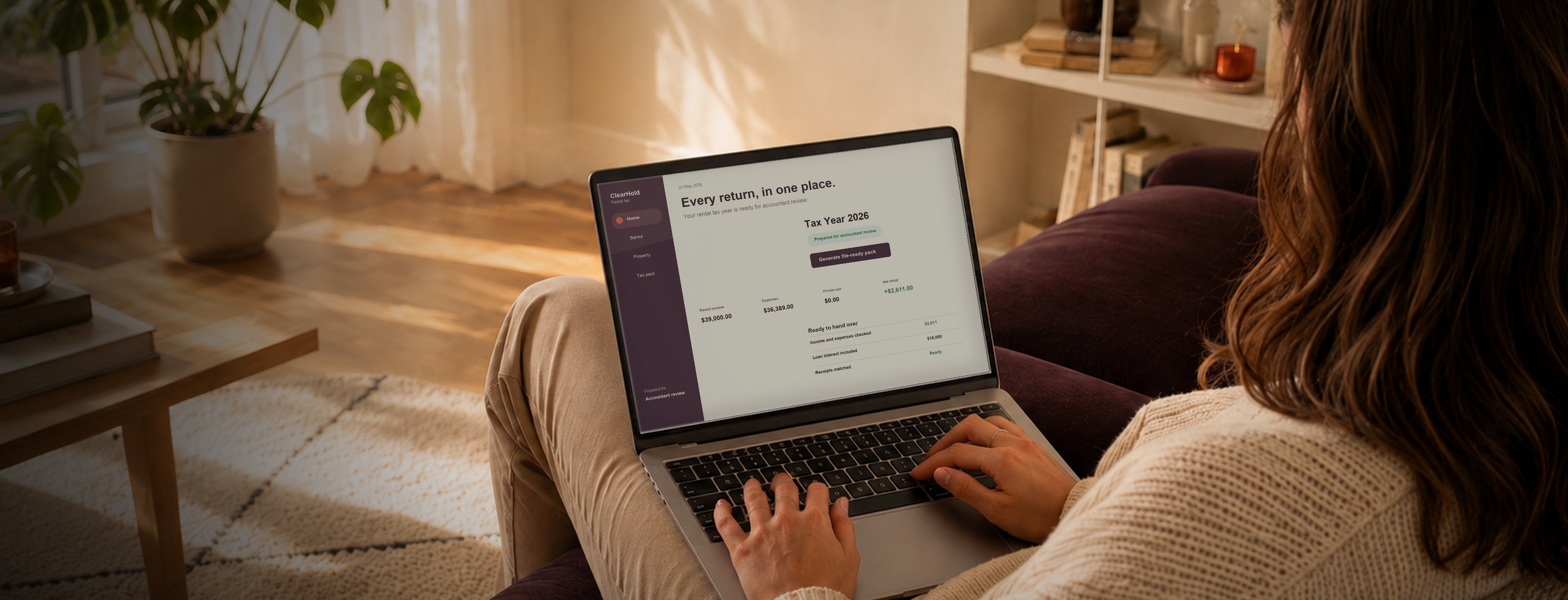 Person reviewing an illustrative ClearHold rental tax summary on a laptop